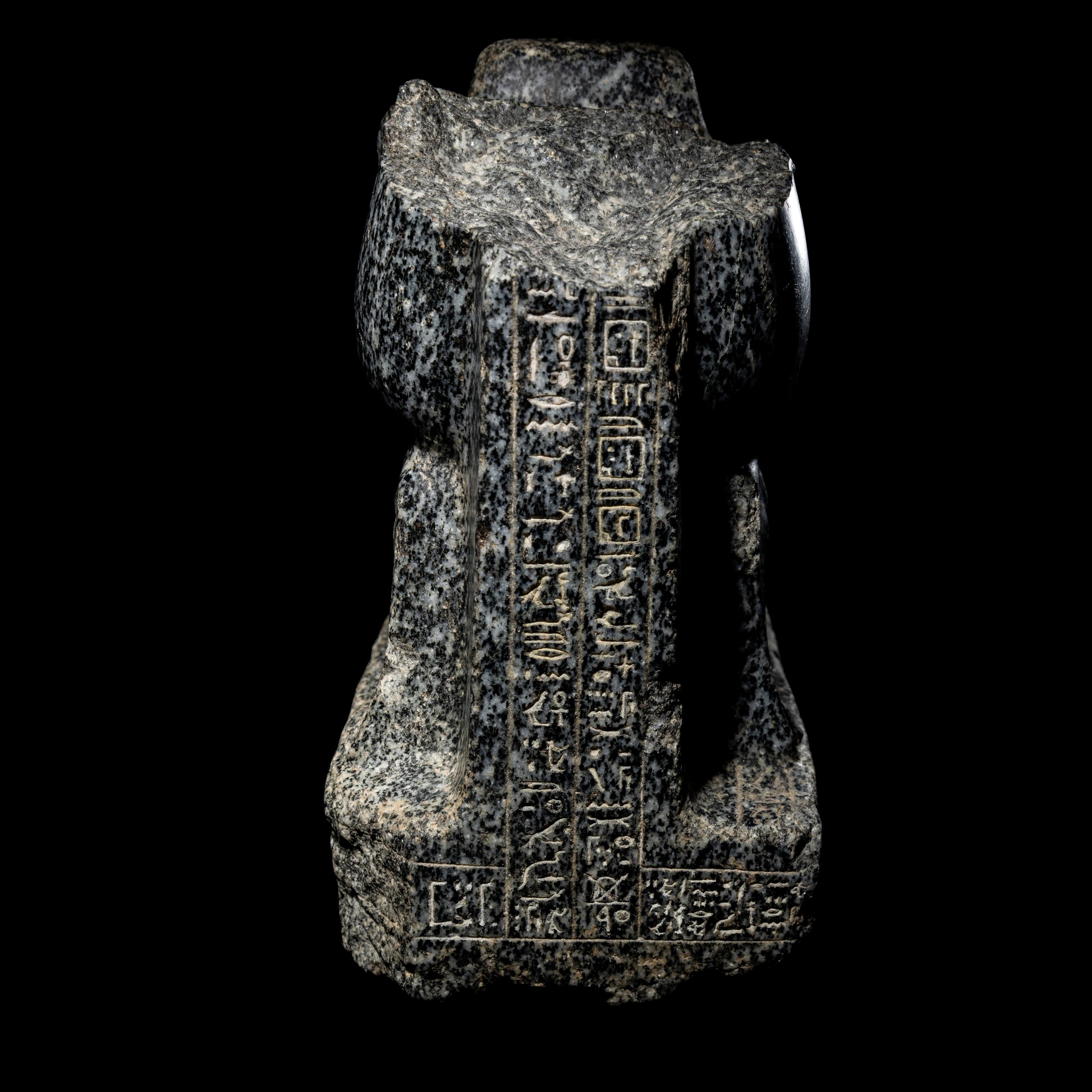 An Egyptian Gneiss Fragment of a Kneeling Figure