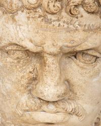 A Continental Carved Stone Head of a Man