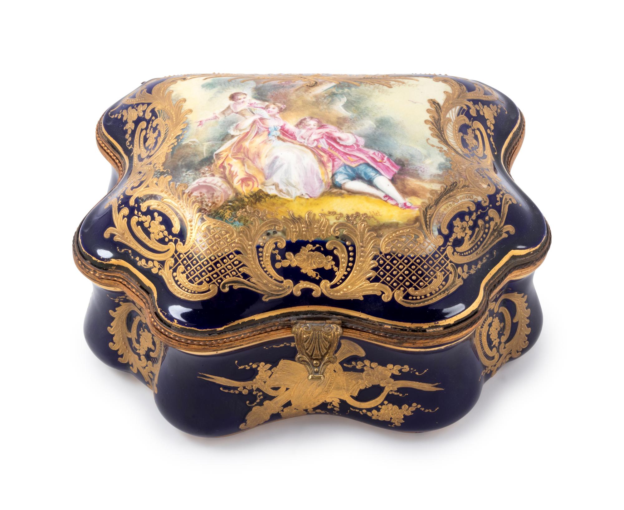 A Sèvres Style Painted and Parcel Gilt Porcelain Table Casket