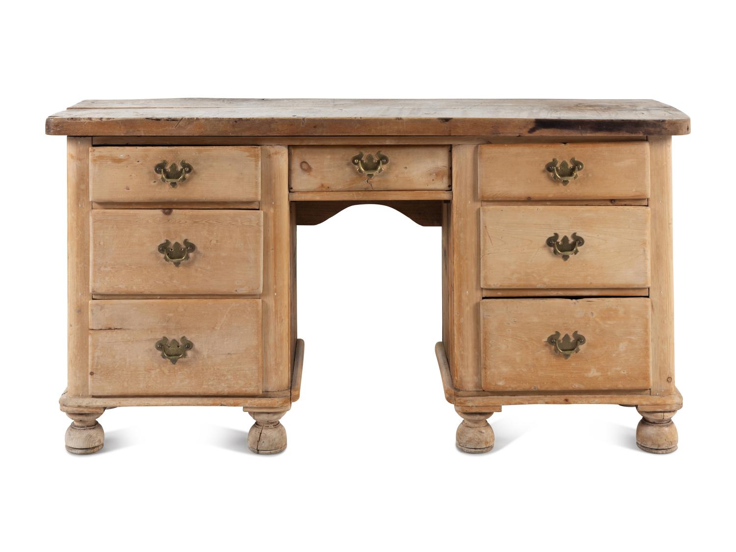 An English Pine Kneehole Dresser