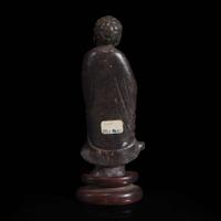 A Chinese carved dark soapstone Luohan 寿山石雕罗汉
