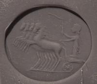 A Roman Chalcedony Ring Stone with a Charioteer Driving a Quadriga