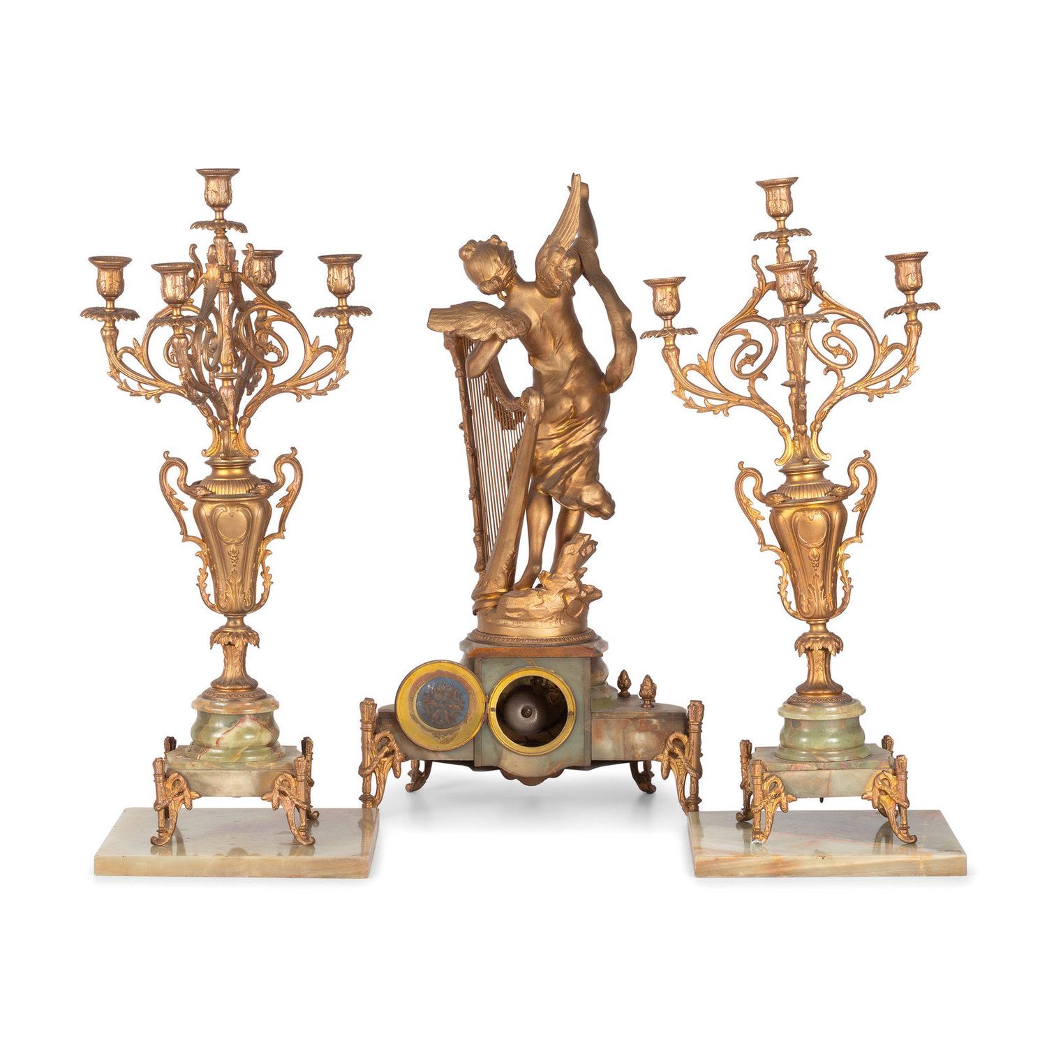 A Neoclassical Gilt Metal and Onyx Clock Garniture