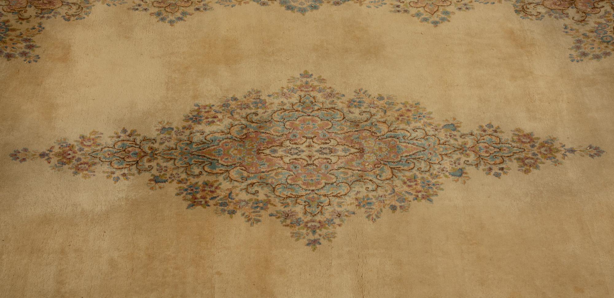 A Kirman Wool Rug — 20th Century
