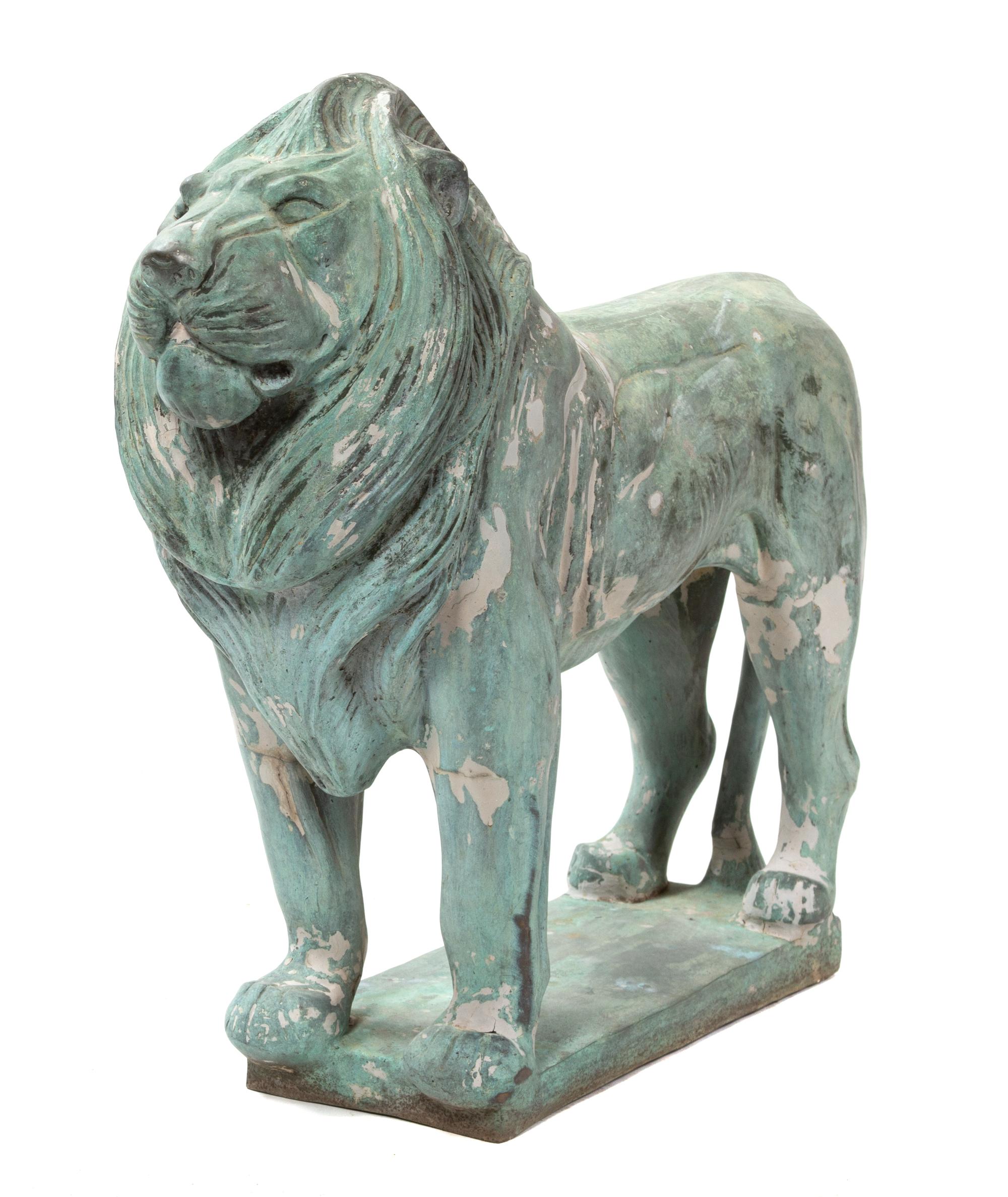 A Bronze Figure of a Standing Lion Height 25 1/2 x length 31 x width 11 inches. — 20TH CENTURY