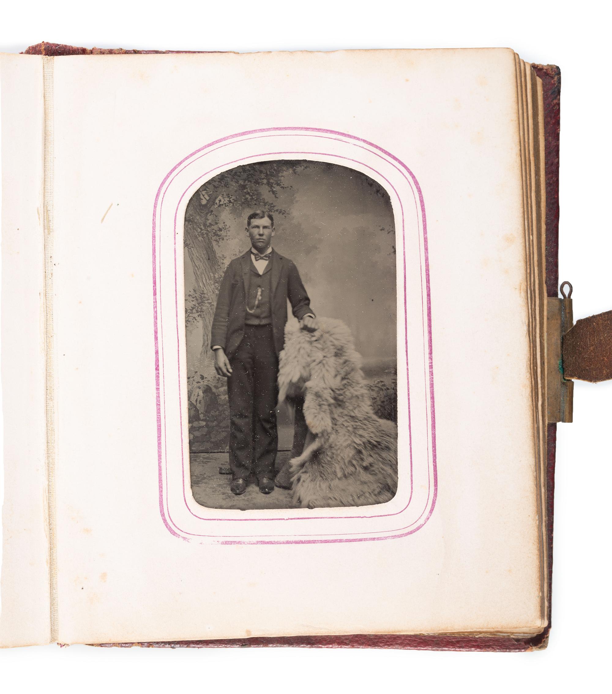 [EARLY PHOTOGRAPHY]. CDV album containing CDV of African American man and Caucasian woman.