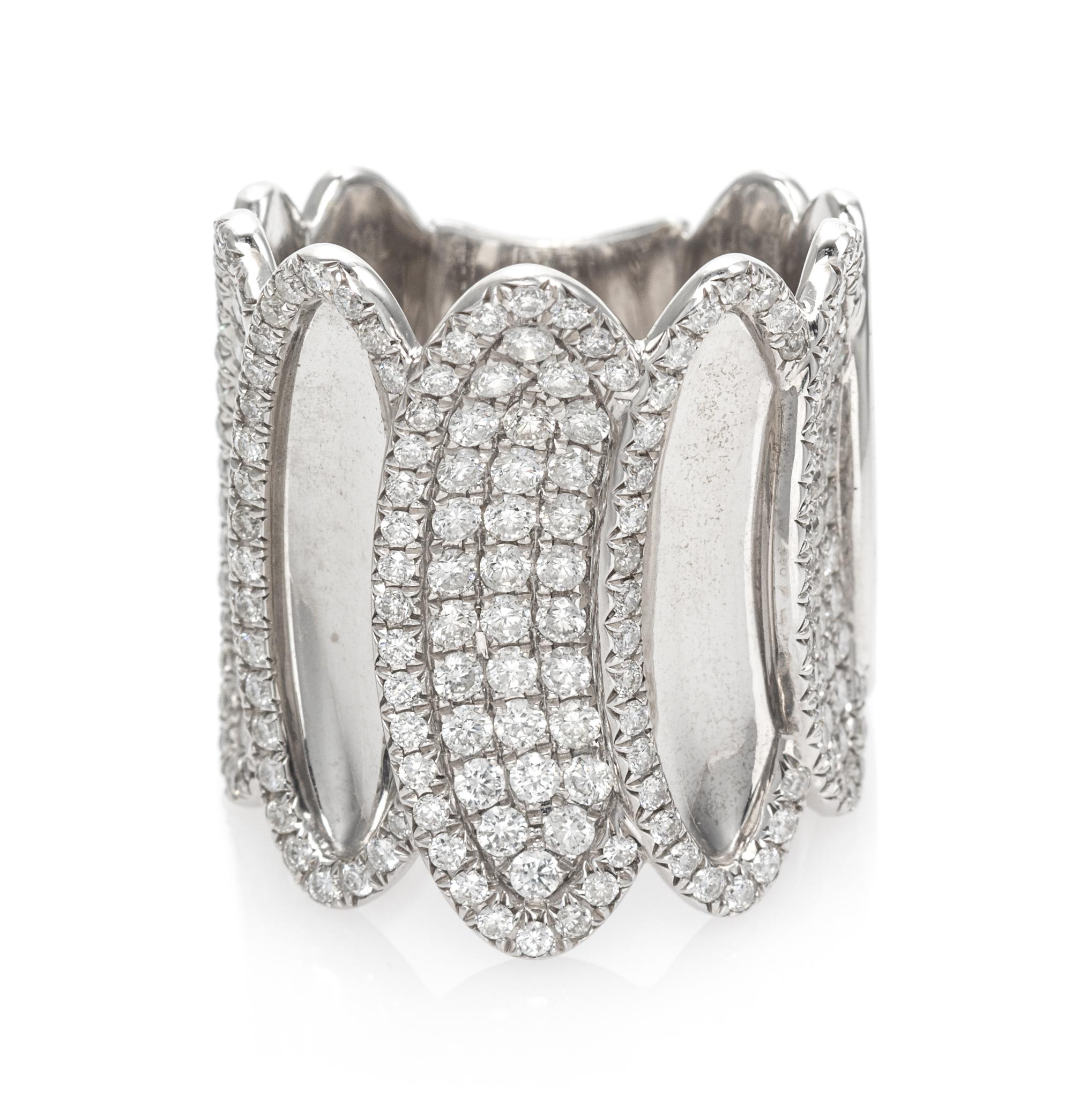 An 18 Karat White Gold and Diamond Band Ring, House of Baguettes, 10.90 dwts.