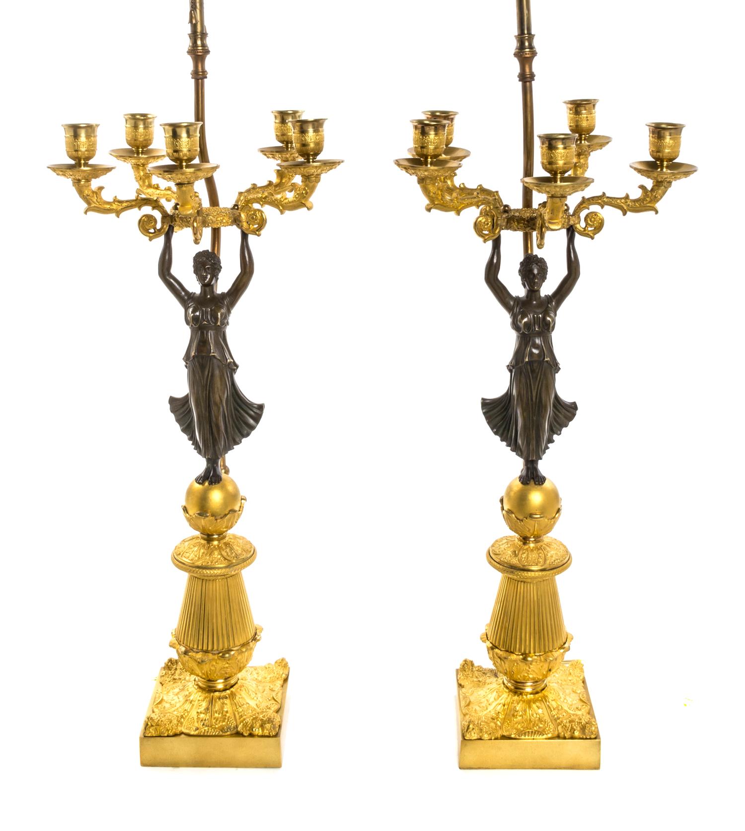 A Pair of Empire Gilt and Patinated Bronze Five-Light Figural Candelabra, Height 22 3/4 inches.