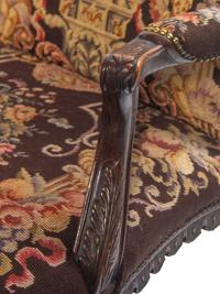 A George II Style Carved Mahogany Armchair with Needlepoint Upholstery