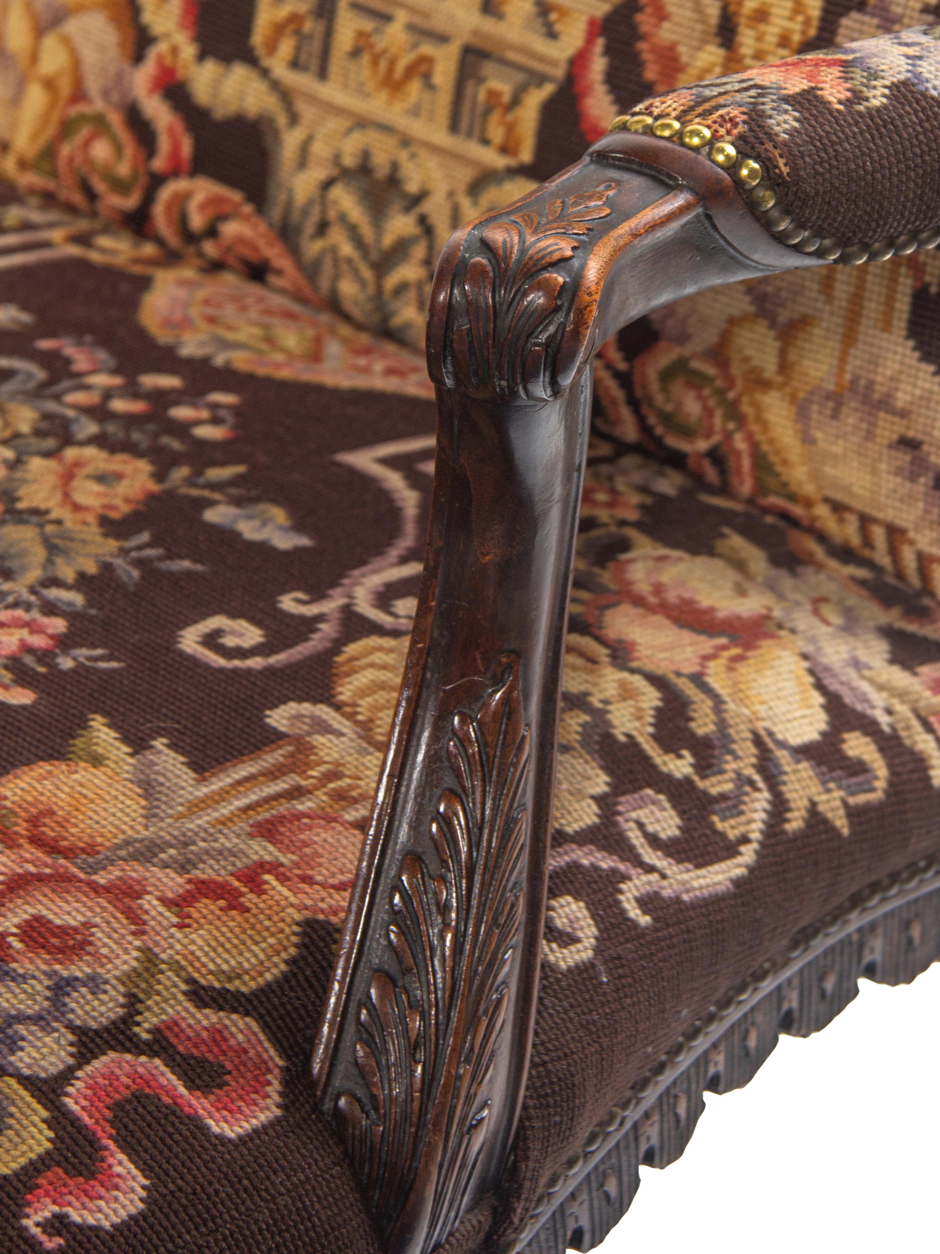 A George II Style Carved Mahogany Armchair with Needlepoint Upholstery