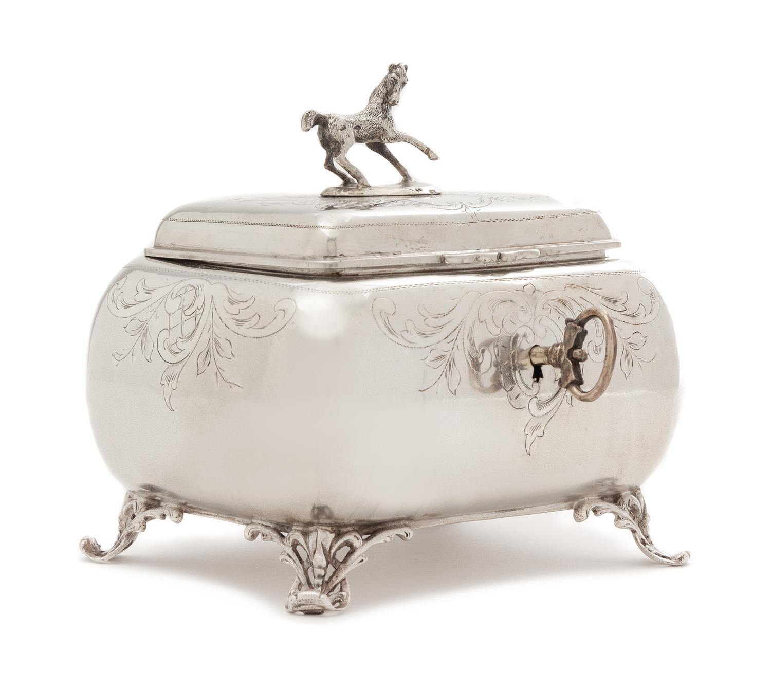 An Austrian Silver Tea Caddy, Maker's Mark H.S., Vienna, Late 19th/Early 20th Century, of lobed rectangular form, the lid with an appli