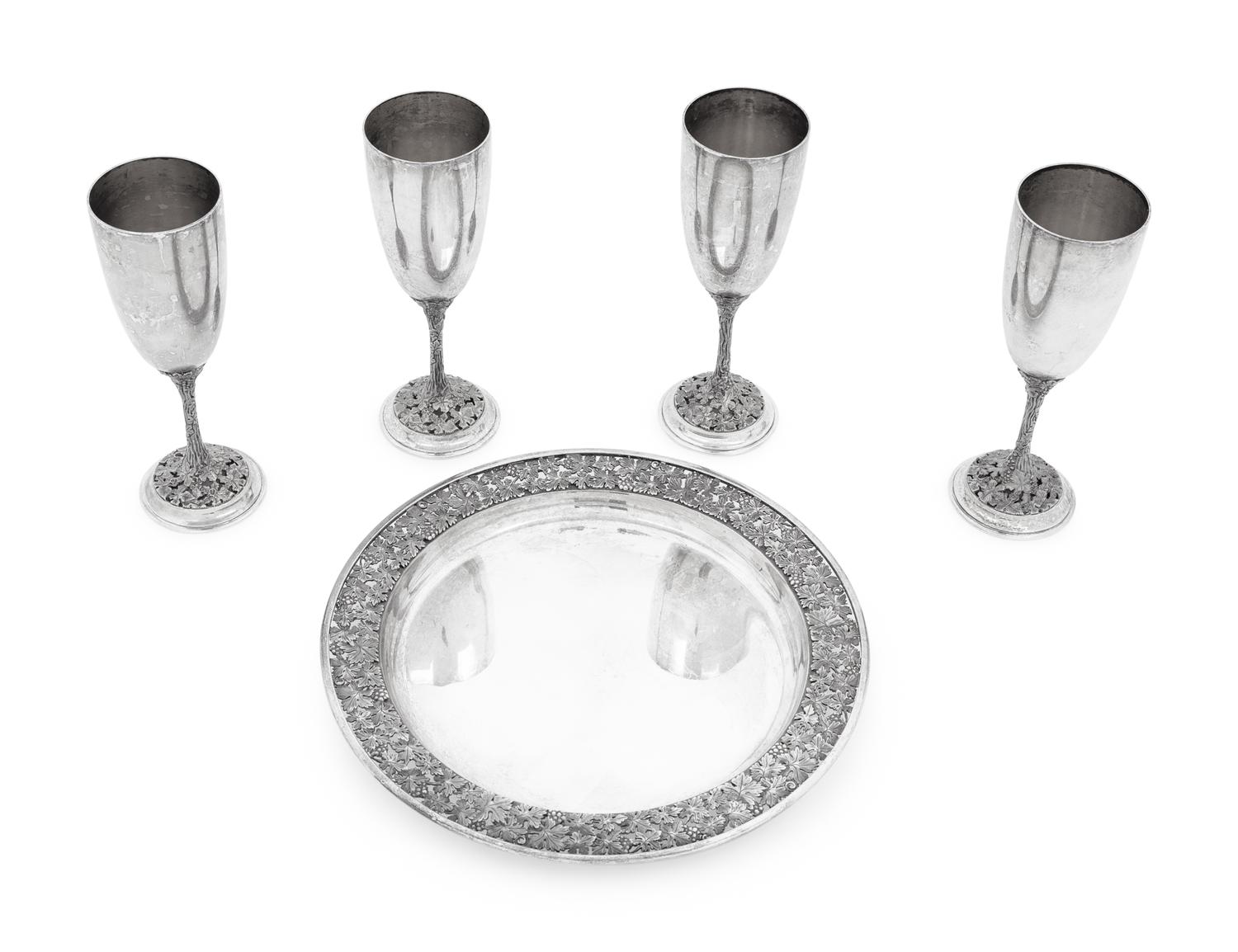 A Set of Four Asprey Silver Champagne Flutes and Tray