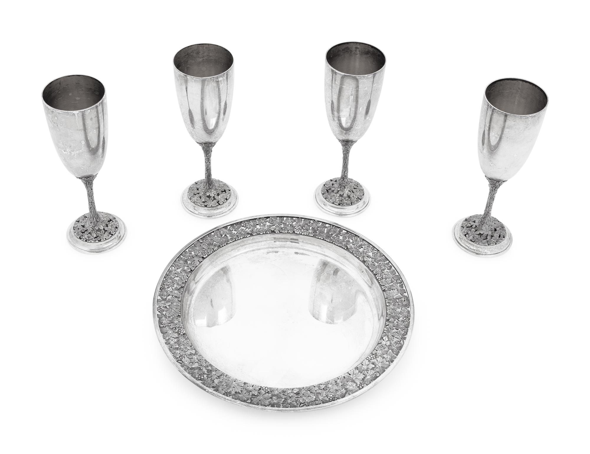 A Set of Four Asprey Silver Champagne Flutes and Tray