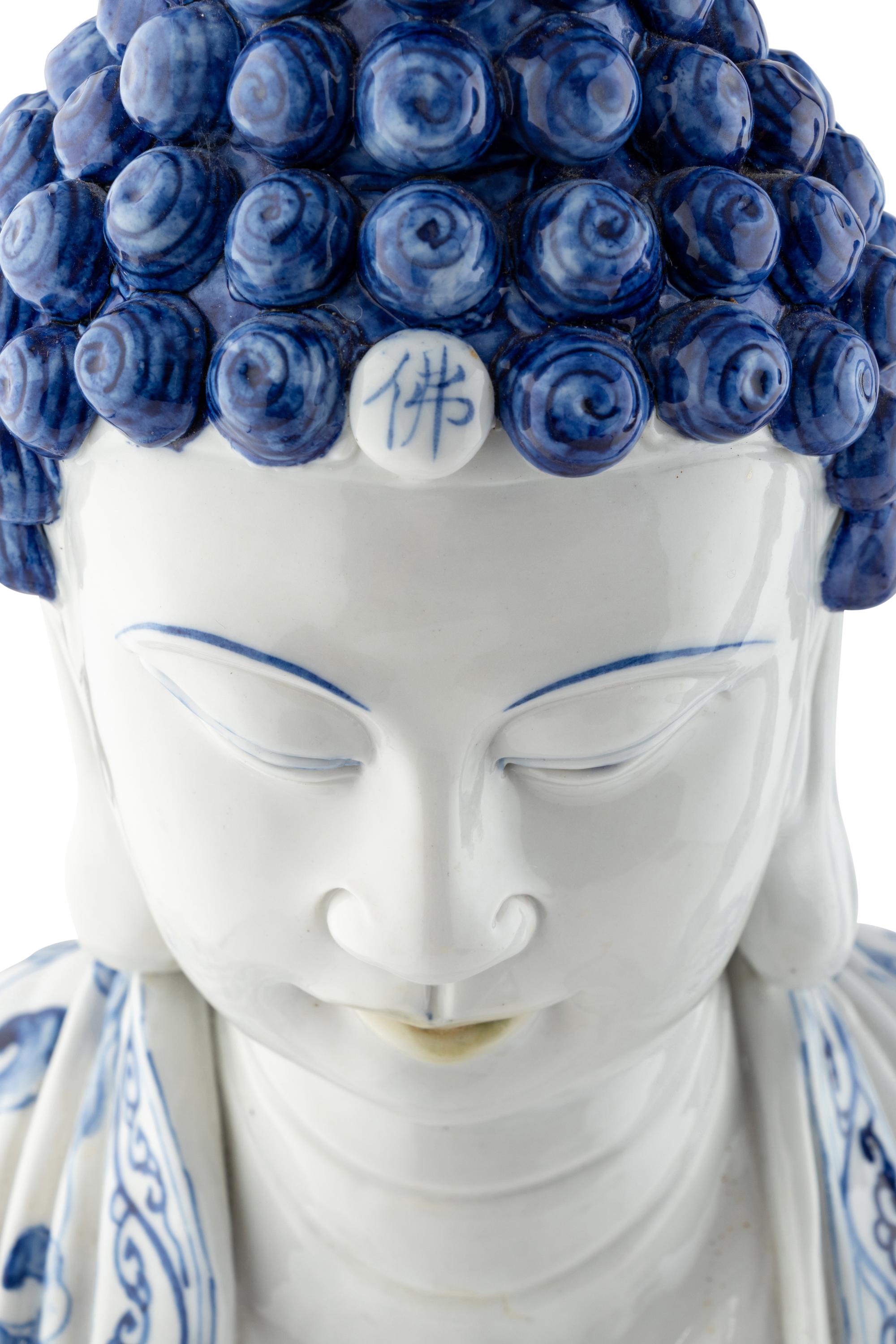 Two Blue and White Glazed Seated Figures