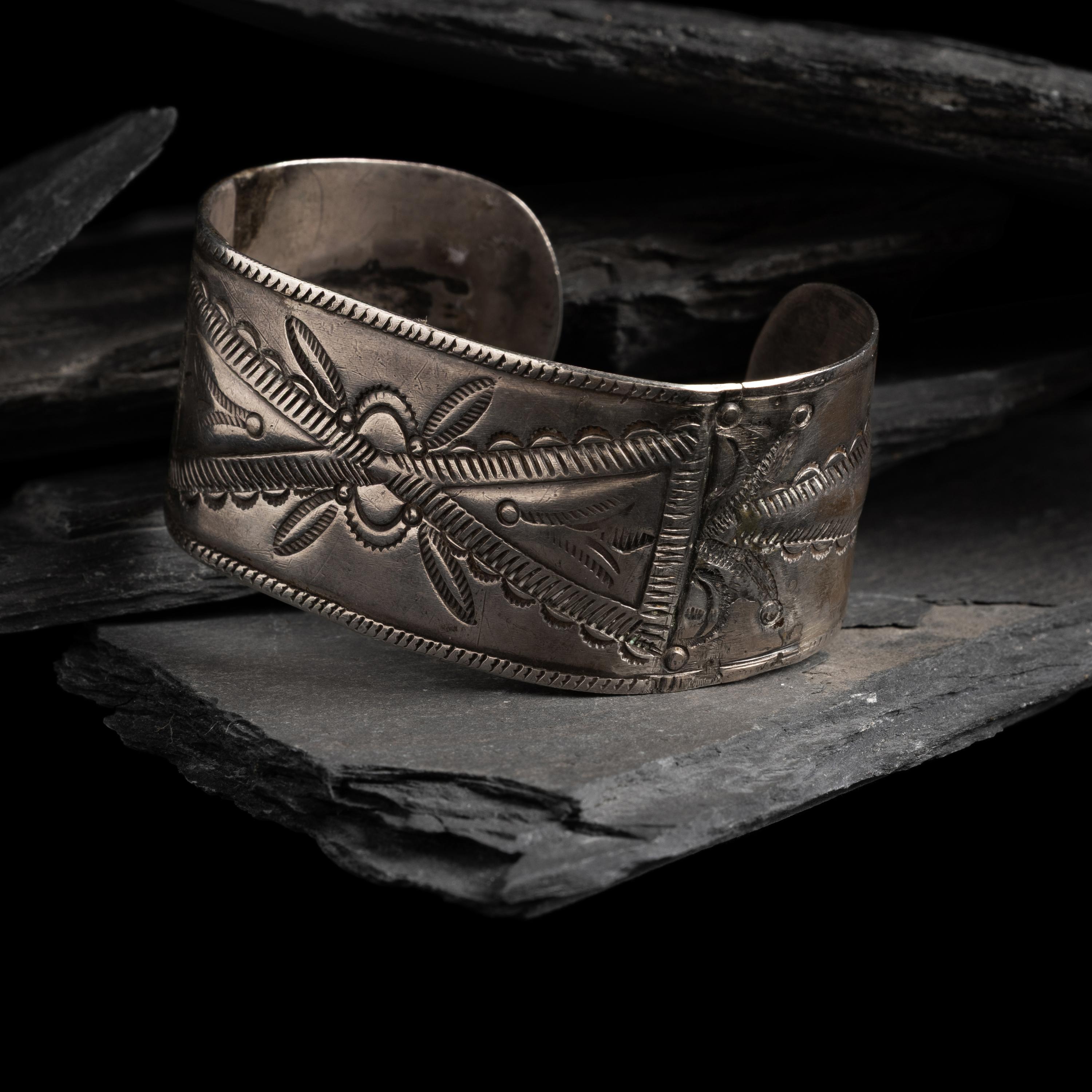 Early Navajo Heavily Stamped and Chiseled Ingot Cuff Bracelet, with Repoussé Elements