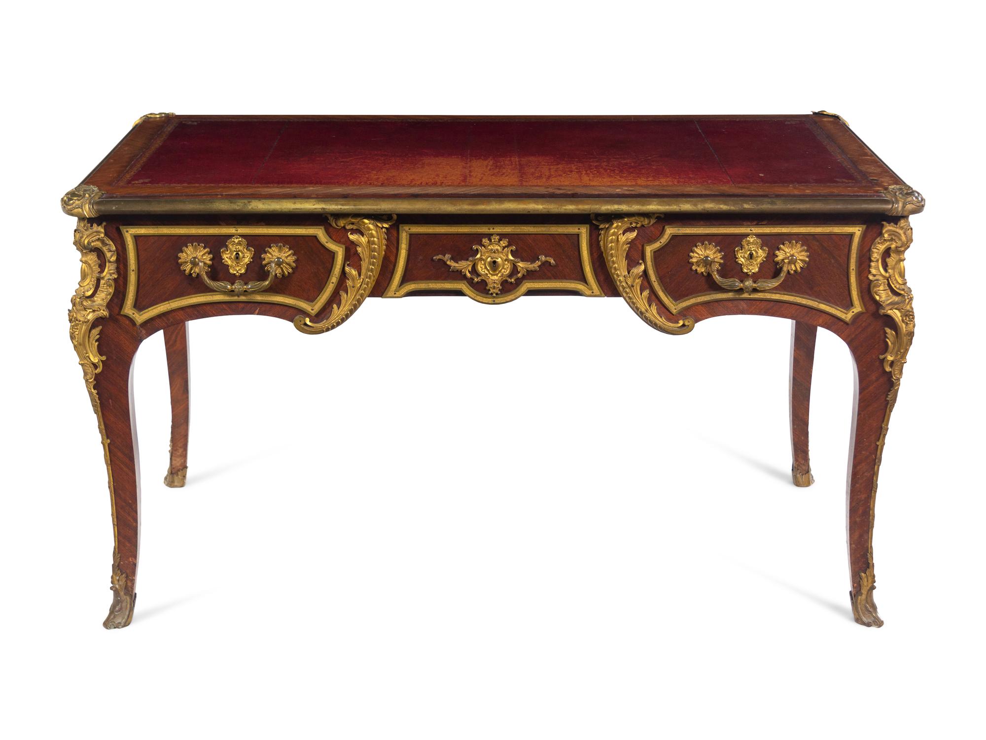 A Louis XV Style Gilt Bronze Mounted Kingwood Bureau Plat