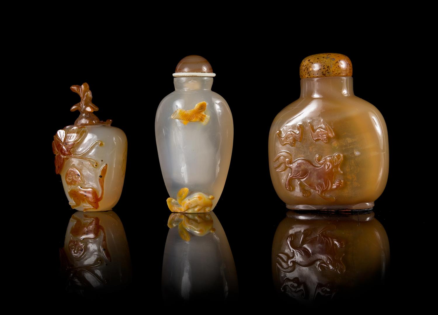 Three Carved Agate Snuff Bottles