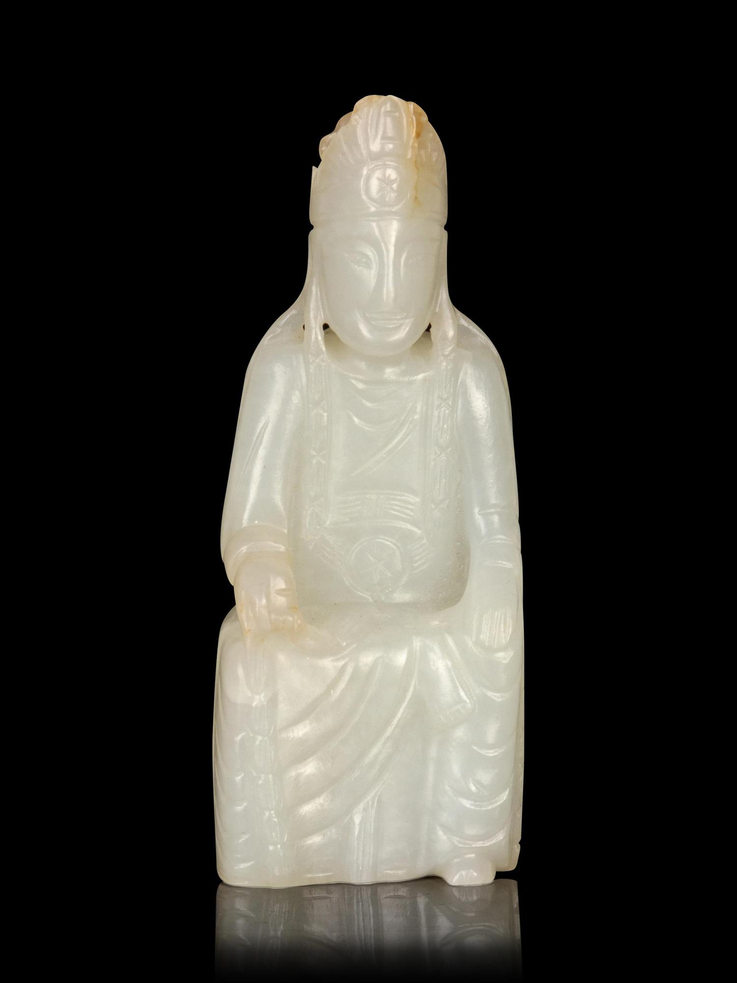 A Carved White Jade Figure of Guanyin