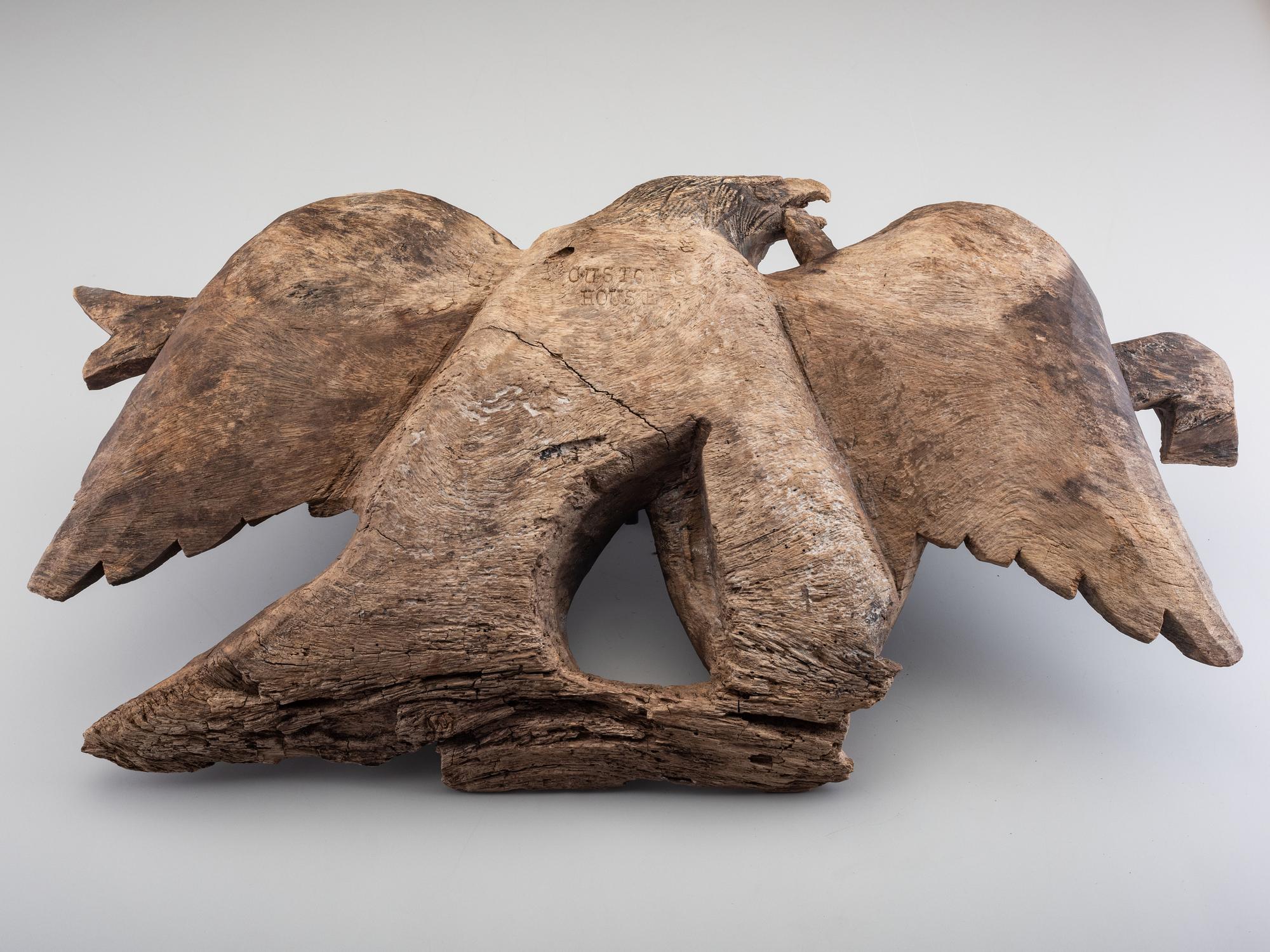 A Carved Walnut Customs House Eagle