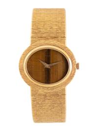PIAGET, 18K YELLOW GOLD AND TIGER'S EYE WATCH