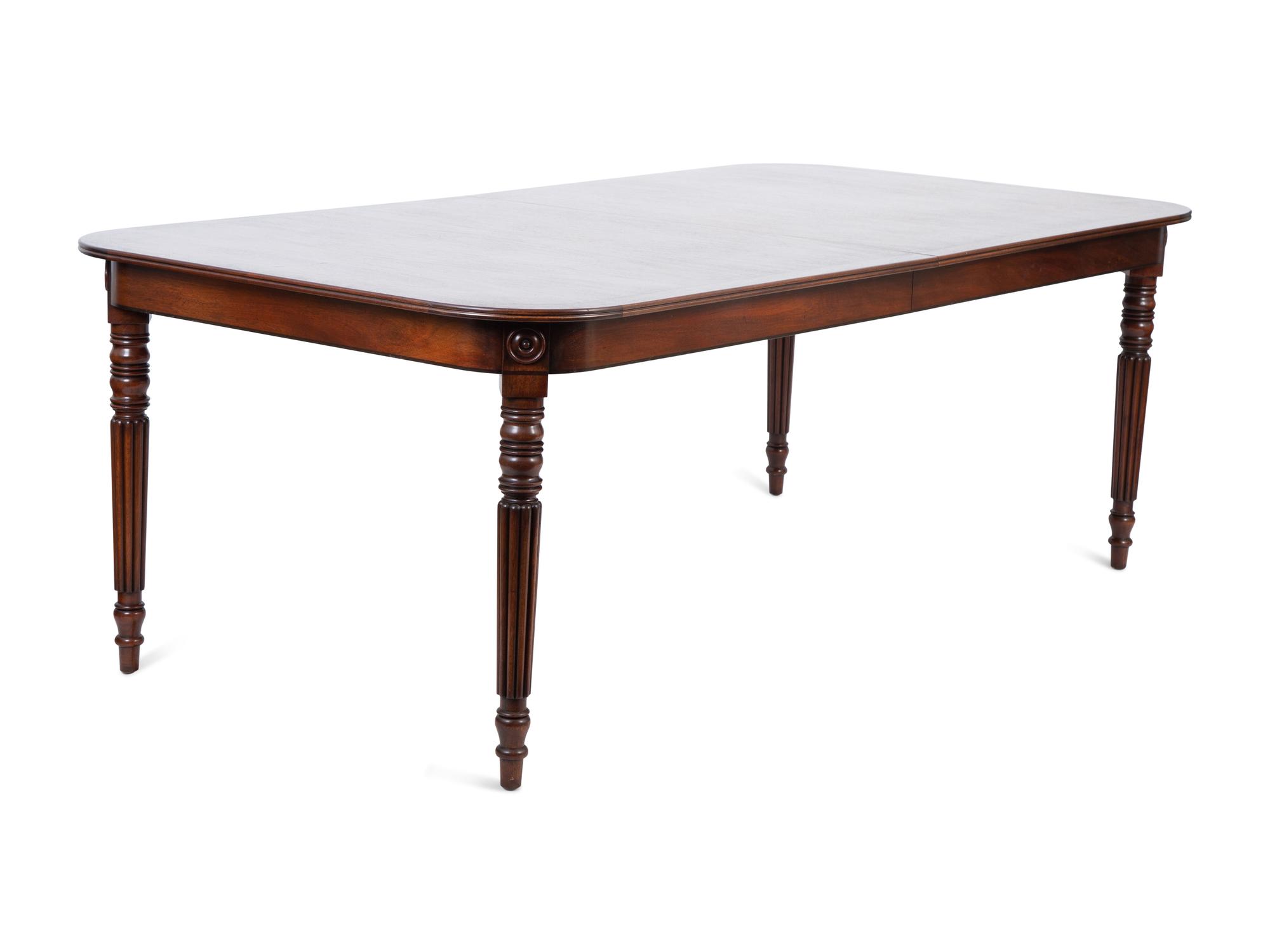A Regency Style Inlaid Mahogany Dining Table