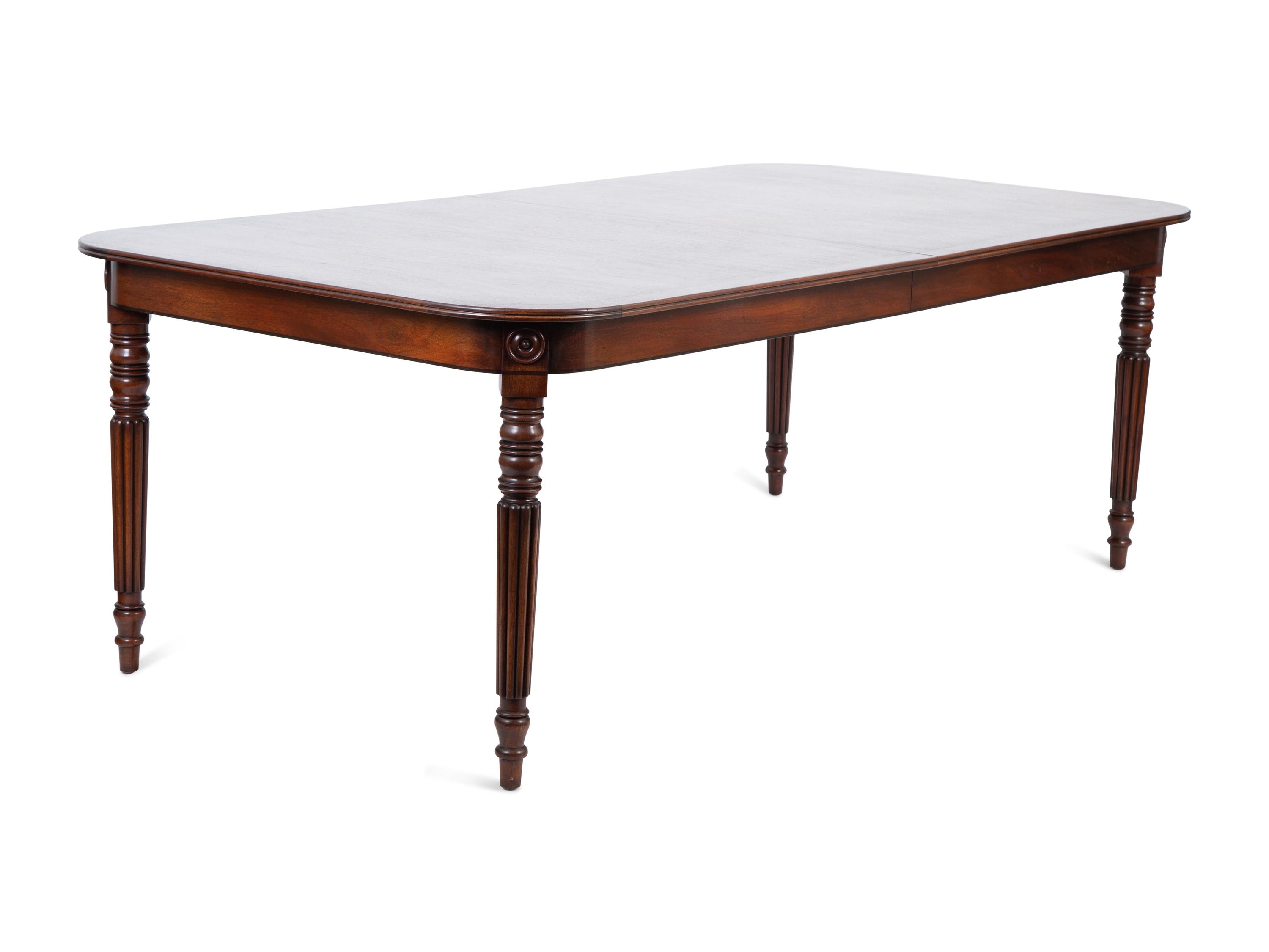 A Regency Style Inlaid Mahogany Dining Table