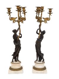 A Pair of French Empire Style Gilt and Patinated Bronze Figural Four-Light Candelabra