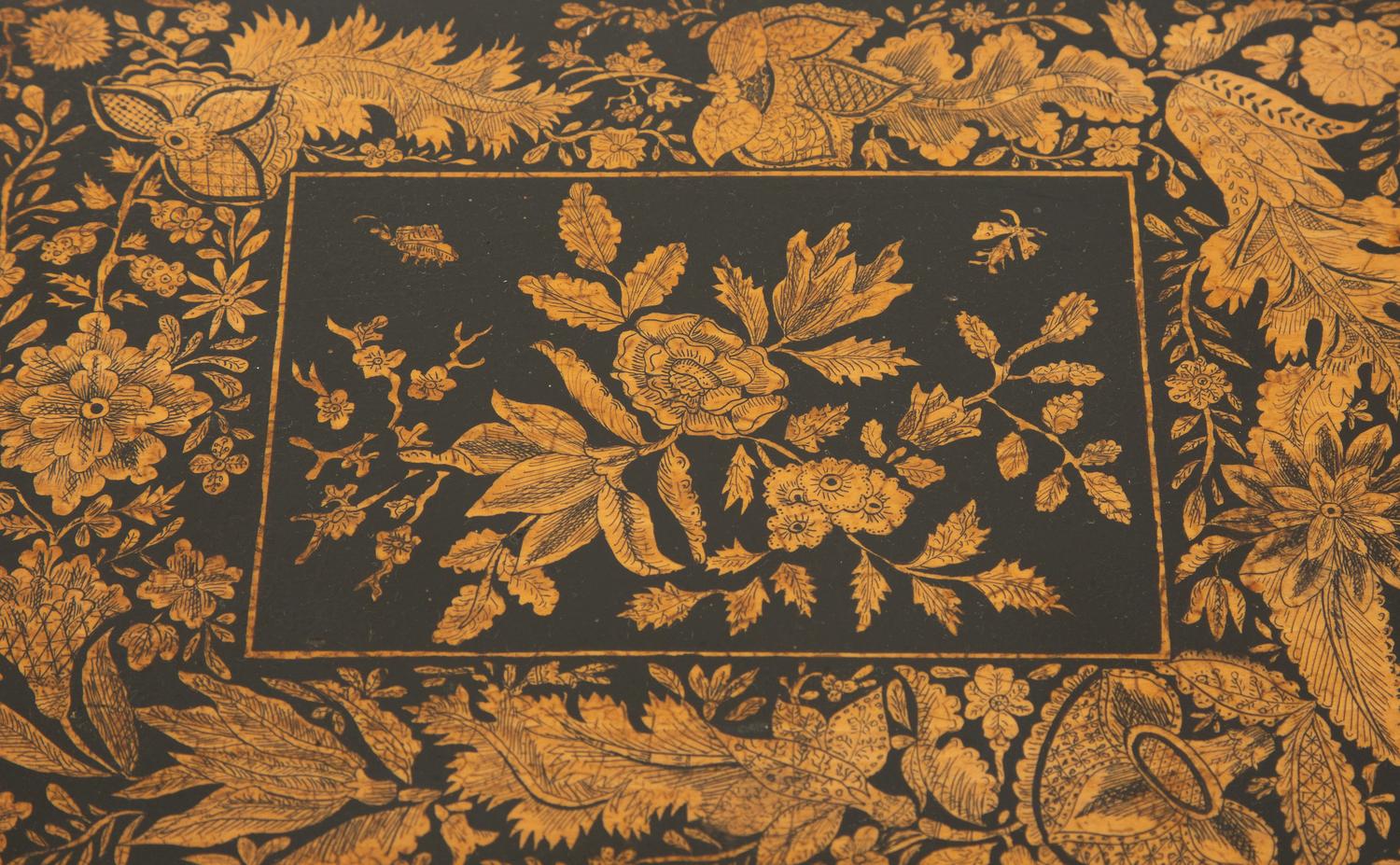A Regency Black and Gilt Lacquer Box on Brass Paw Feet