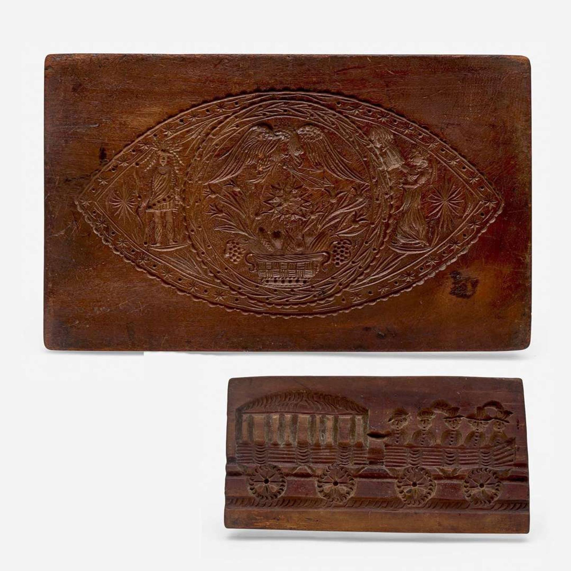 Two carved walnut cake boards 19th century