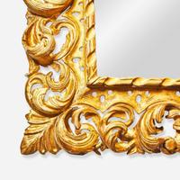 An elaborate Italian carved giltwood mirror 18th / 19th century