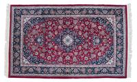 A Persian Wool and Silk Rug 9 feet x 5 feet 8 inches. — 20TH CENTURY