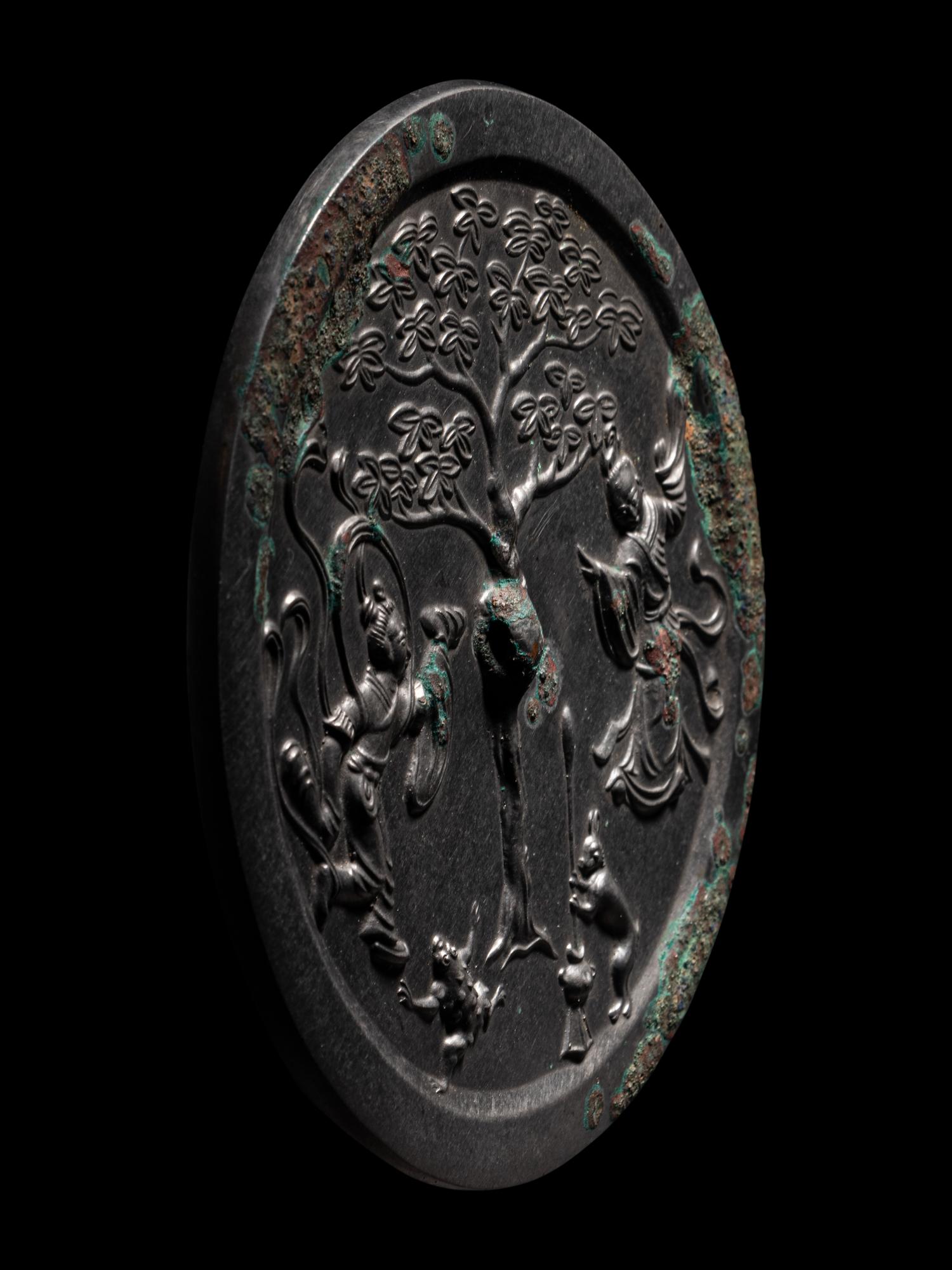 A Bronze 'Moon Palace' Mirror