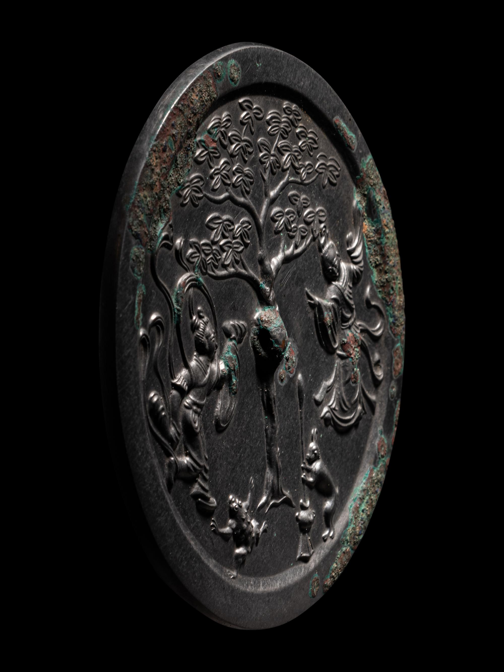 A Bronze 'Moon Palace' Mirror