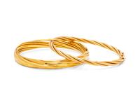 A Collection of 14 Karat Yellow Gold Bangle Bracelets,