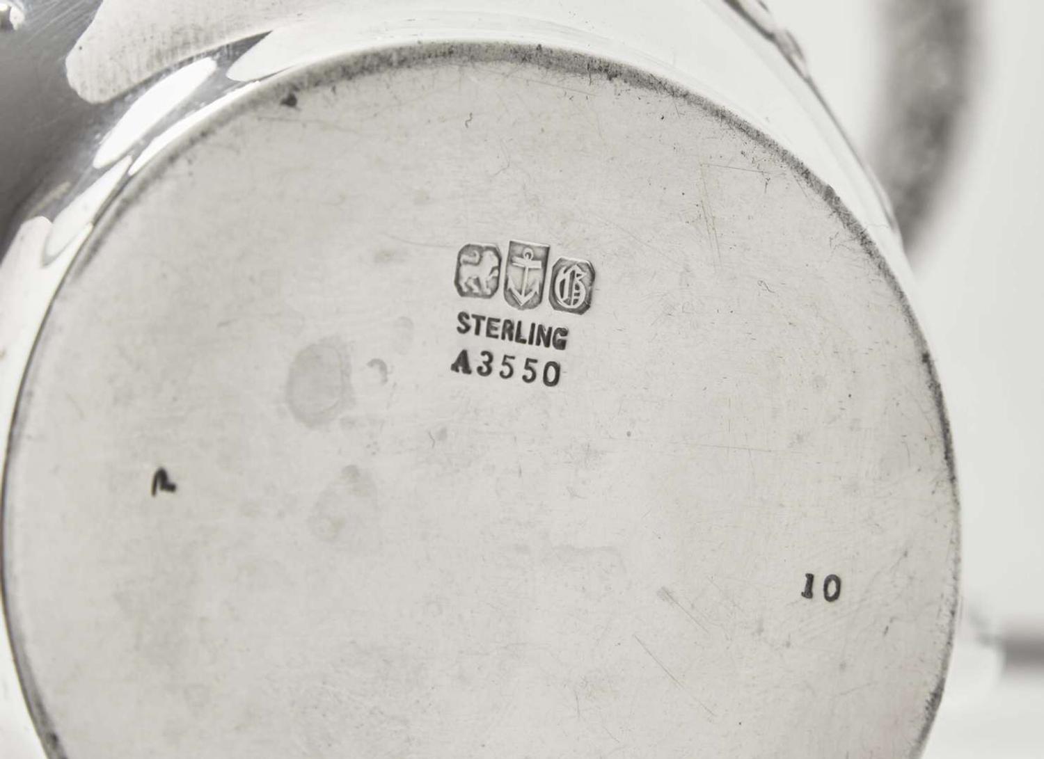 A five-piece sterling silver floral repoussé tea and coffee service, Gorham Mfg. Co., Providence, RI, bearing date mark for 1883