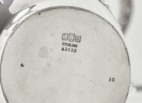A five-piece sterling silver floral repoussé tea and coffee service, Gorham Mfg. Co., Providence, RI, bearing date mark for 1883