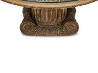 A Neoclassical Style Carved Wood Columnar Base Table with Gilt Decorated Smoke Glass Top