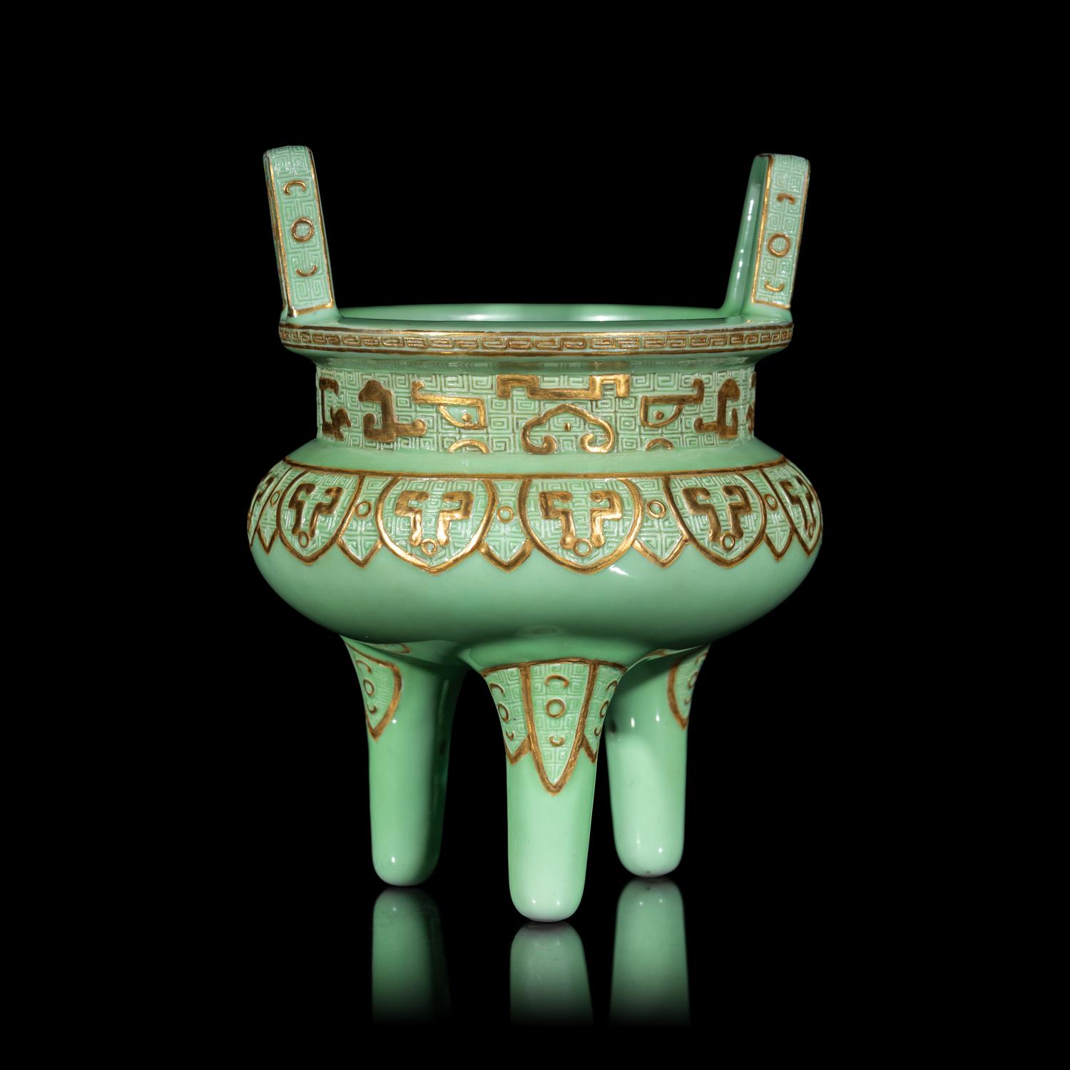A Chinese Gilt Highlighted Green Glazed Porcelain Ding -Form Censer, Qing Dynasty 清 綠地金彩凸雕仿古鼎式爐