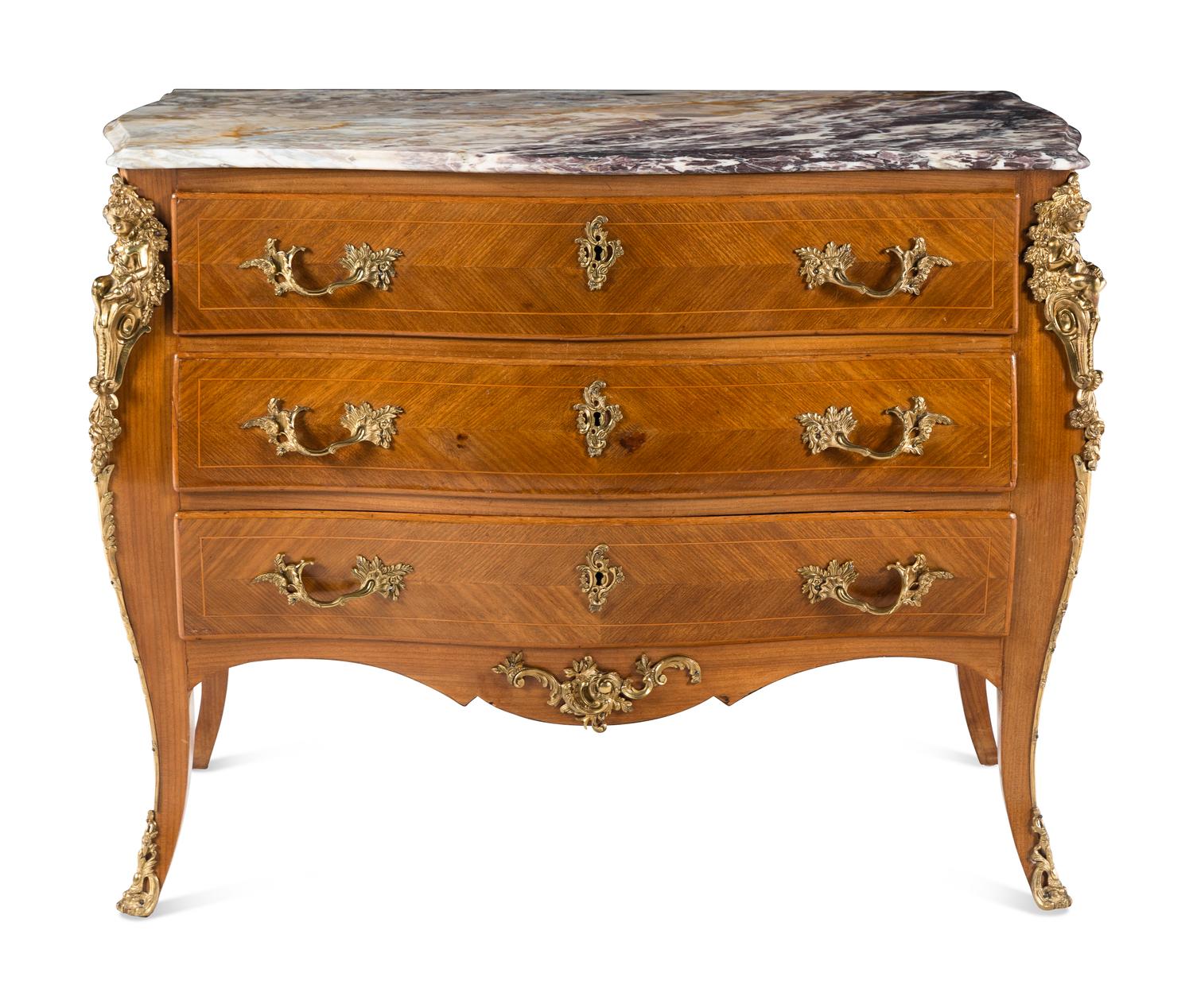 A Régence Style Gilt Metal Mounted Marble-Top Commode