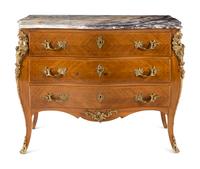 A Régence Style Gilt Metal Mounted Marble-Top Commode