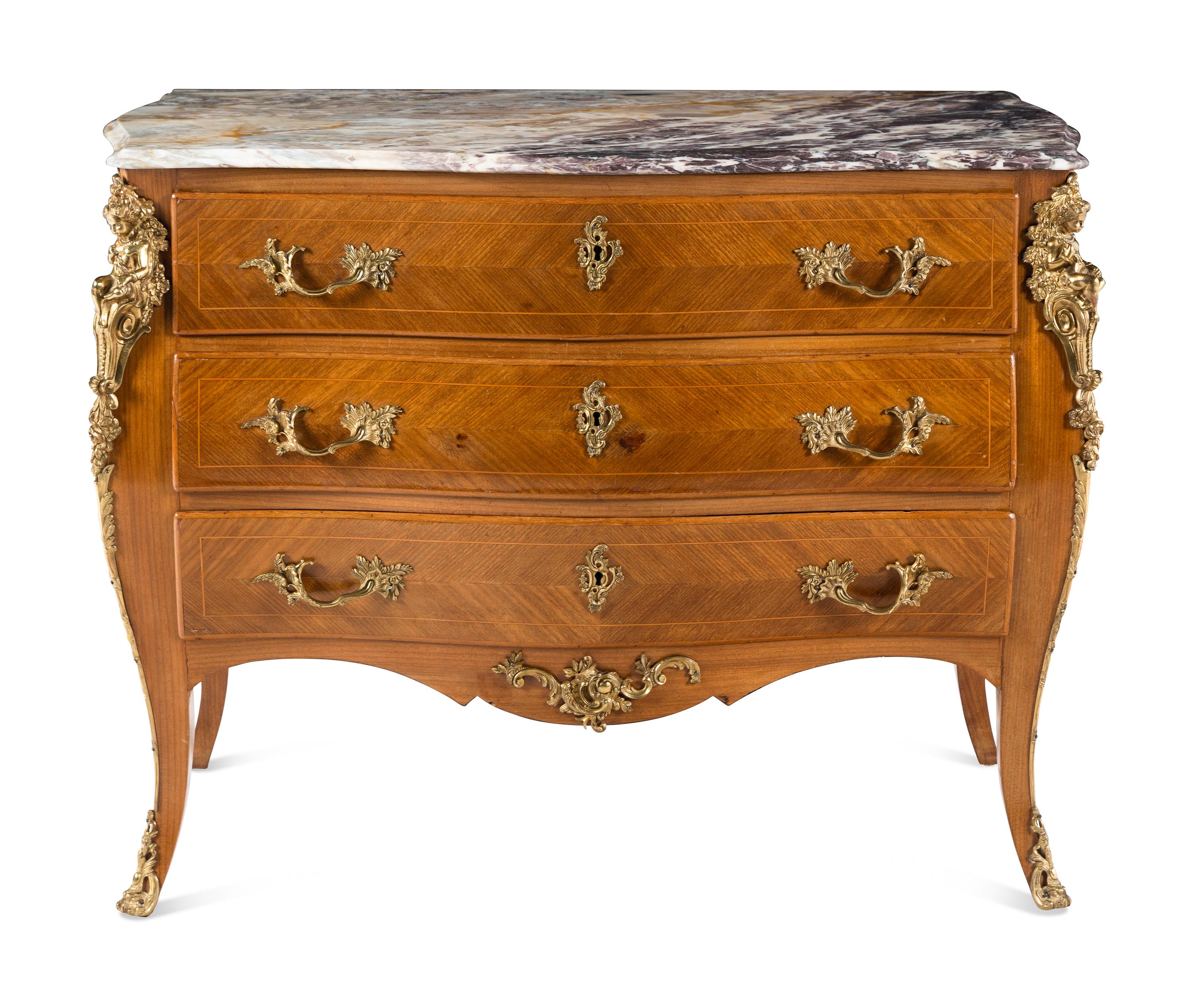 A Régence Style Gilt Metal Mounted Marble-Top Commode