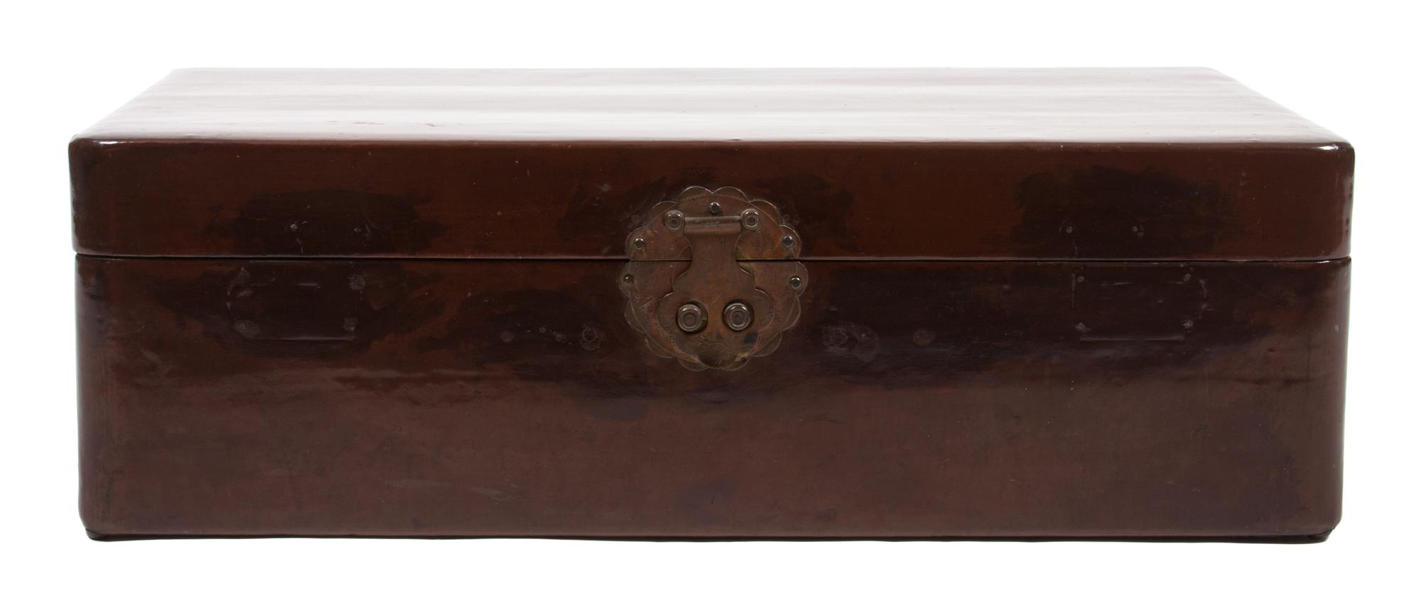 A Wooden Trunk with Engraved Clasp