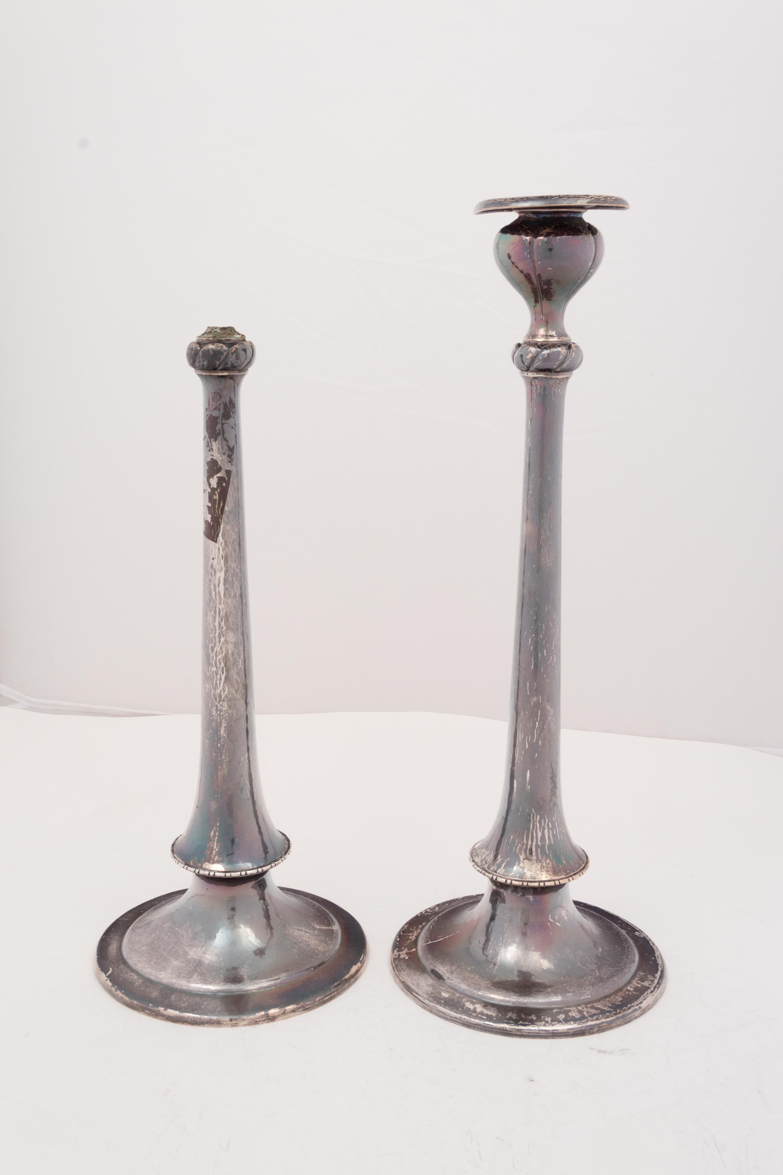 A Pair of Arts & Crafts Spot-Hammered Silver Candlesticks