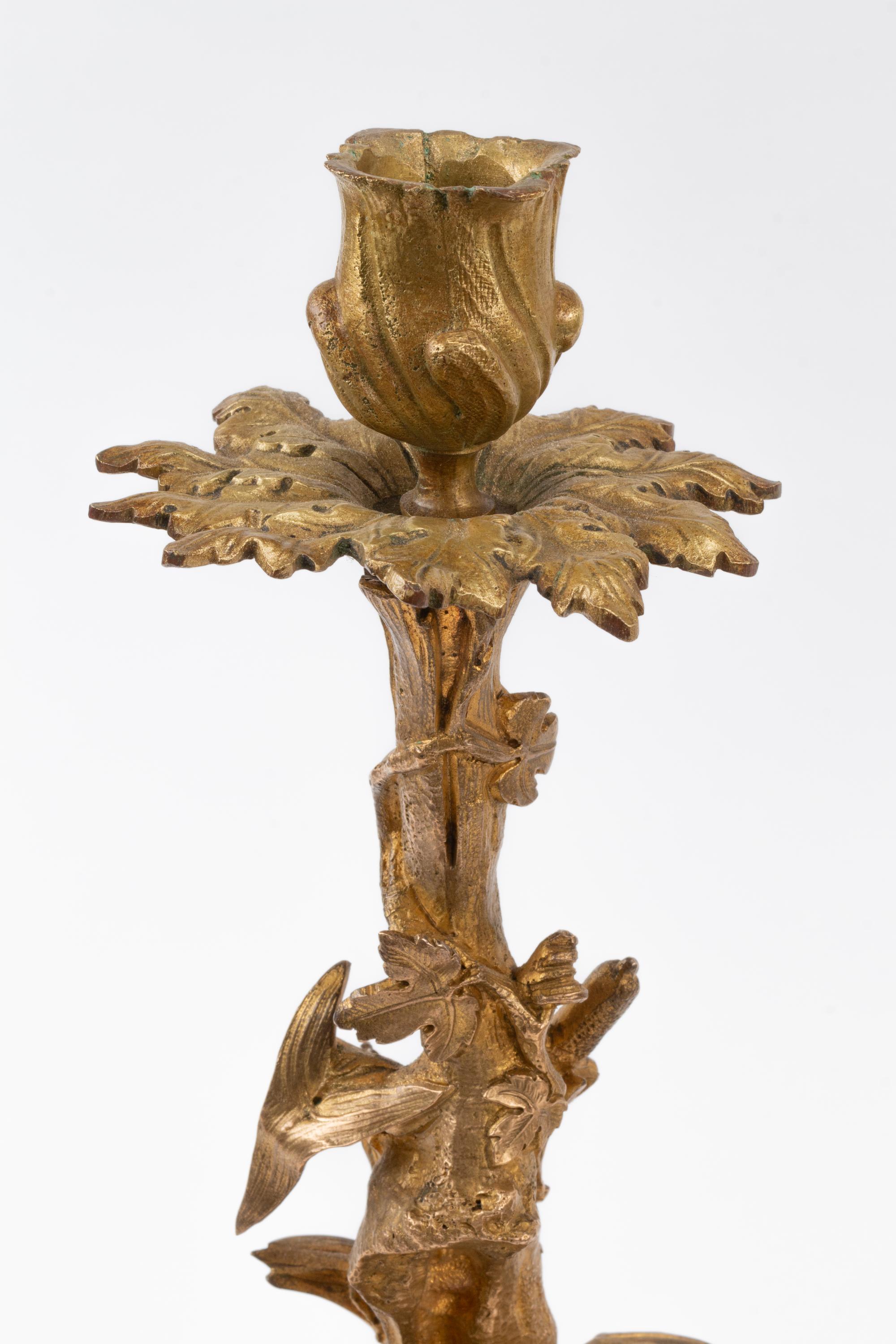A Pair of Napoleon III Silvered Bronze and Marble Candlesticks