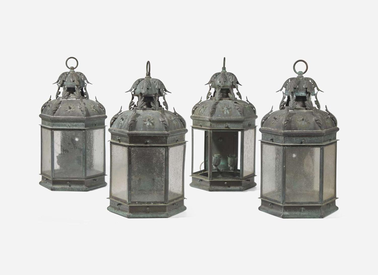 A group of four patinated copper wall-mounted lanterns, modern
