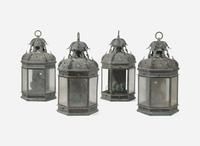 A group of four patinated copper wall-mounted lanterns, modern