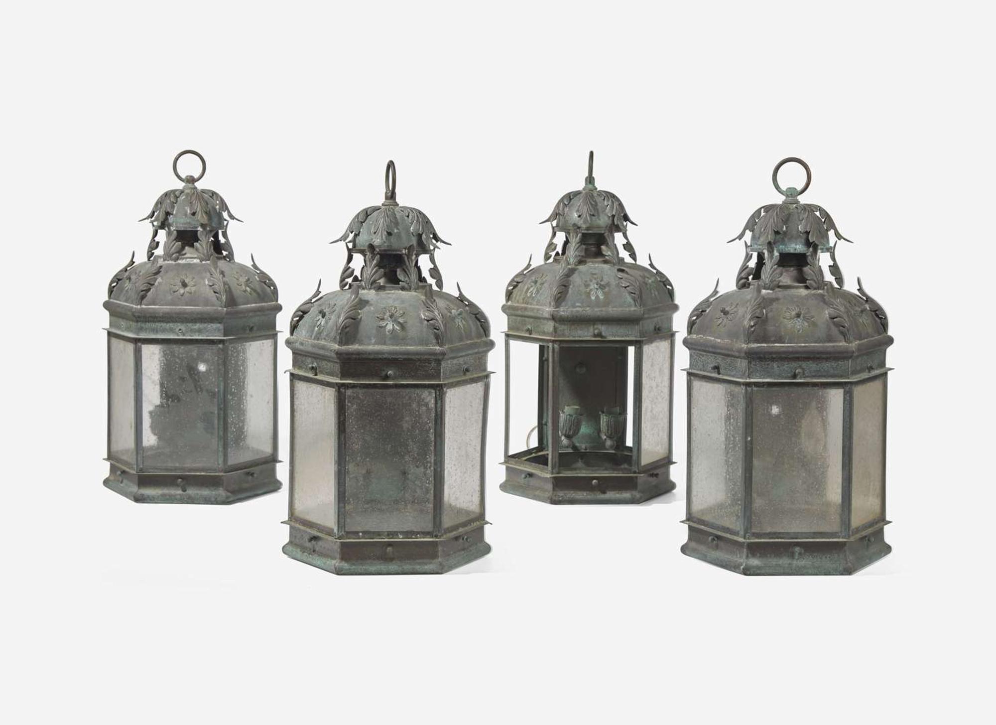 A group of four patinated copper wall-mounted lanterns, modern