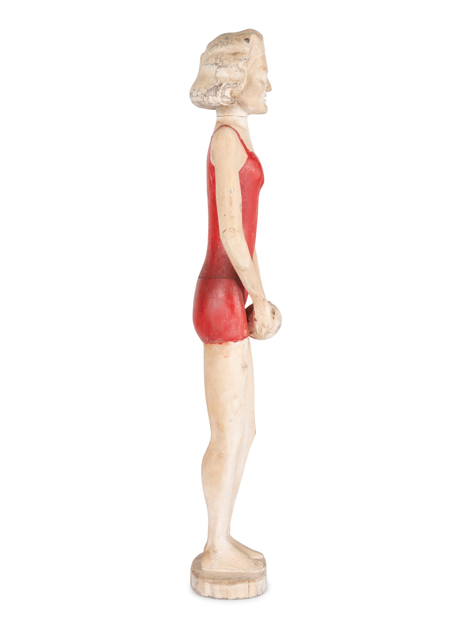 A Carved and Painted Wood Figure of a Bather