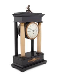 An Empire Style Gilt Metal and Alabaster Mounted Ebonized Clock