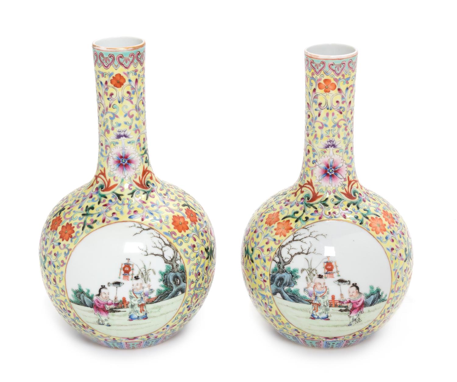 A Pair of Yellow Ground Famille Rose Porcelain Bottle Vases Height of each 9 inches. — LATE 19TH CENTURY
